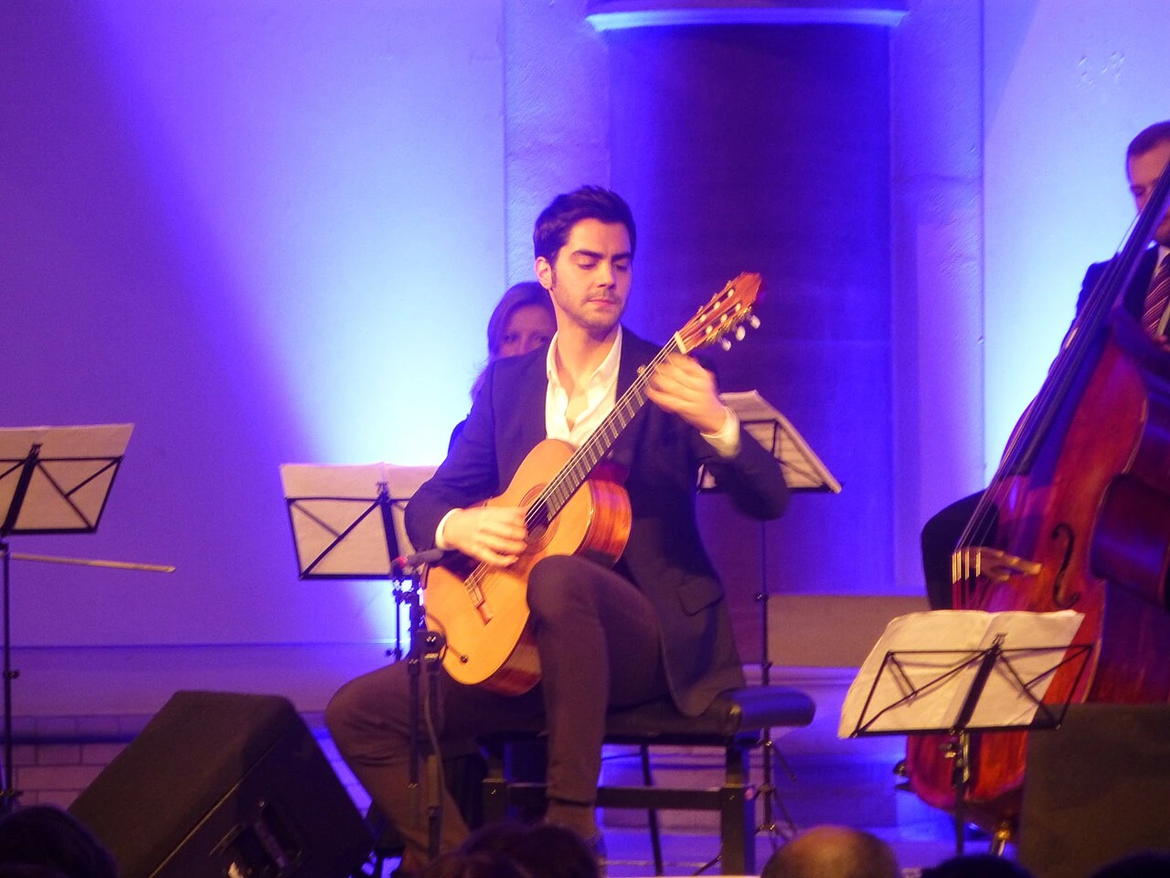 Miloš Karadaglić performing on classical guitar on stage