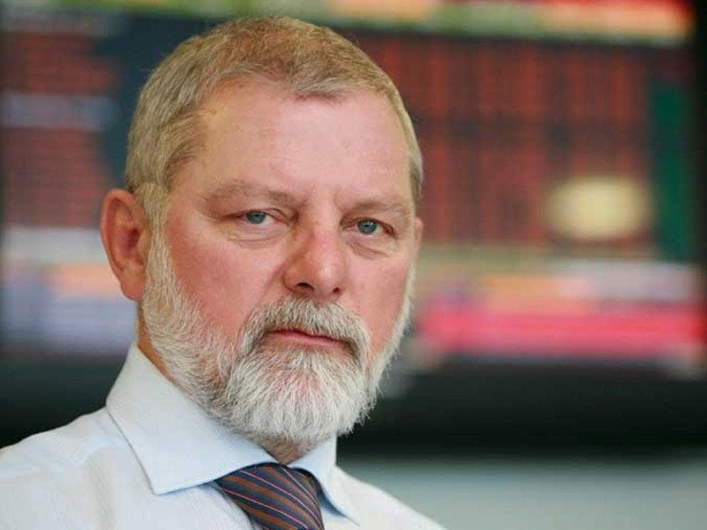 Portrait photo of Vuk Hamović in a suit and tie, posed against a blurred background.